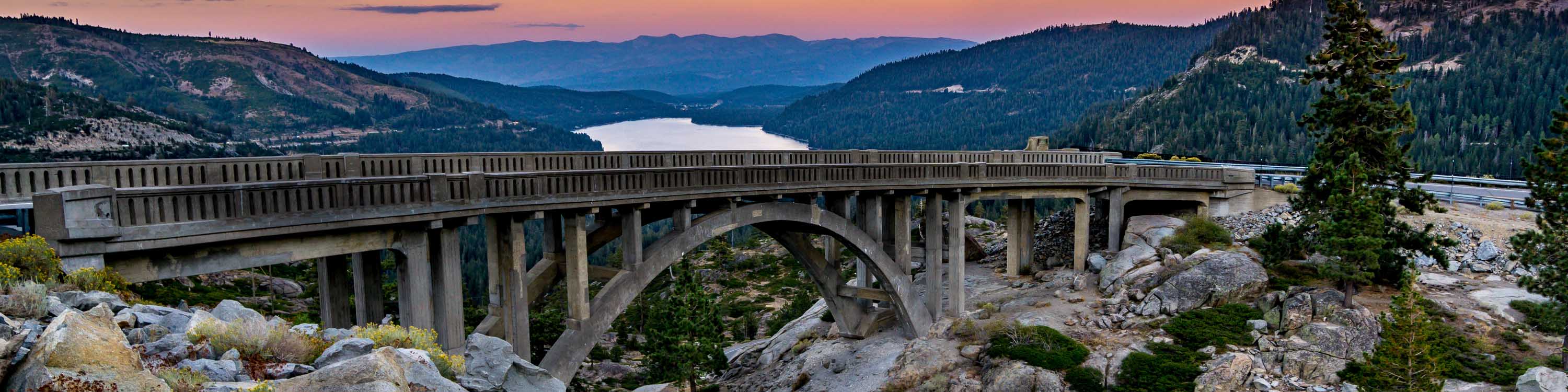 Image of Donner Lake at sunset with bridge in the foreground.